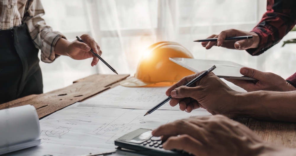 engineers around a project table