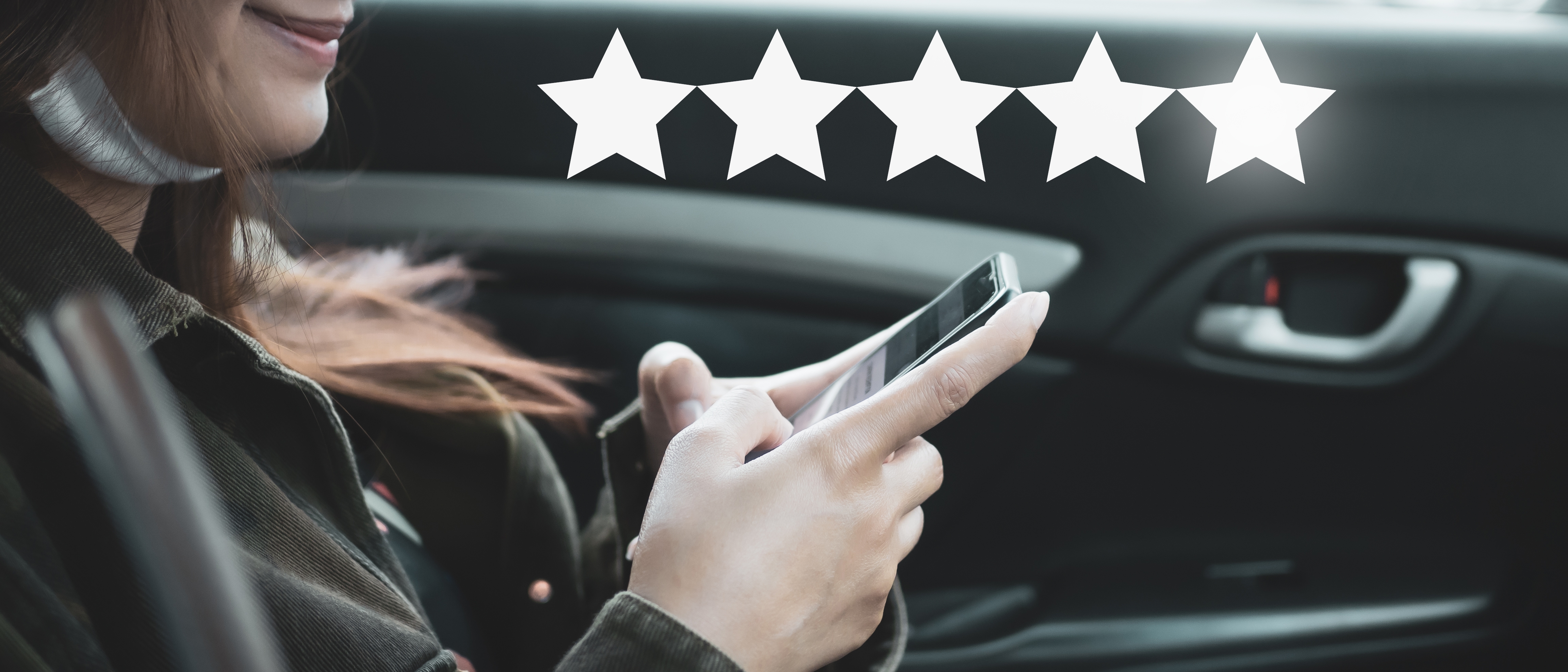 a woman giving a review inside her car